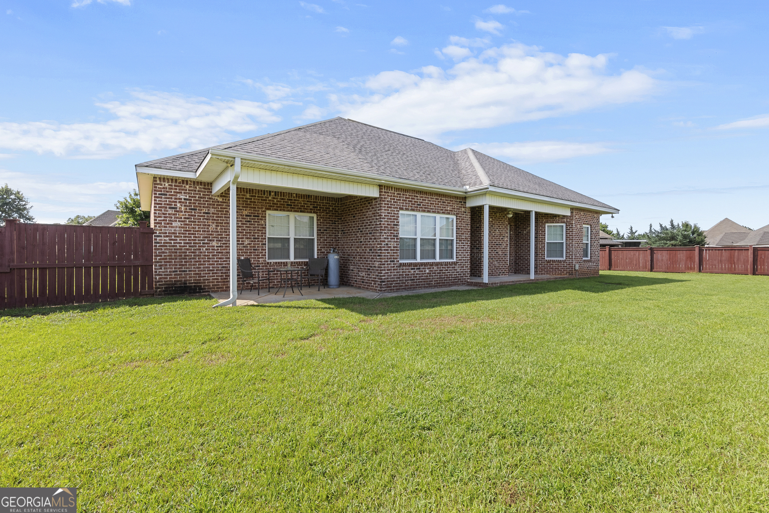 217 Caleb Way Byron, GA 31008 - Photo 52 of 58 a front view of a house with a garden