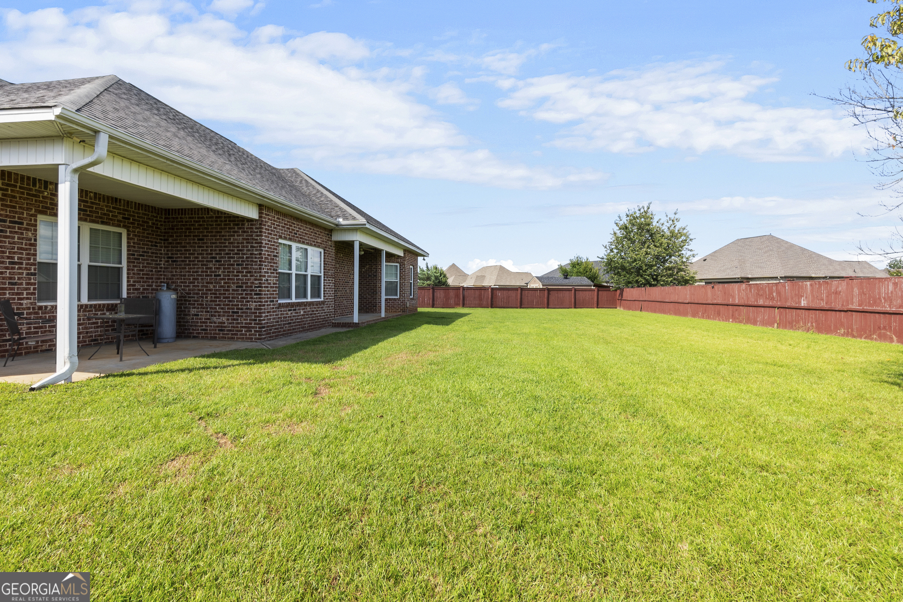 217 Caleb Way Byron, GA 31008 - Photo 53 of 58 a view of a house with a garden and yard