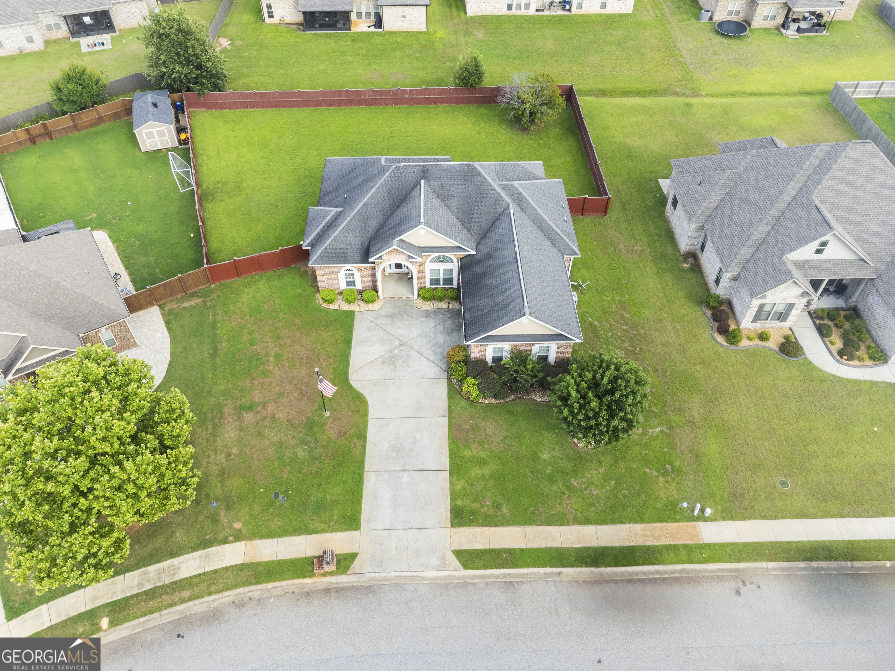 217 Caleb Way Byron, GA 31008 - Photo 54 of 58 an aerial view of a house with a garden and houses