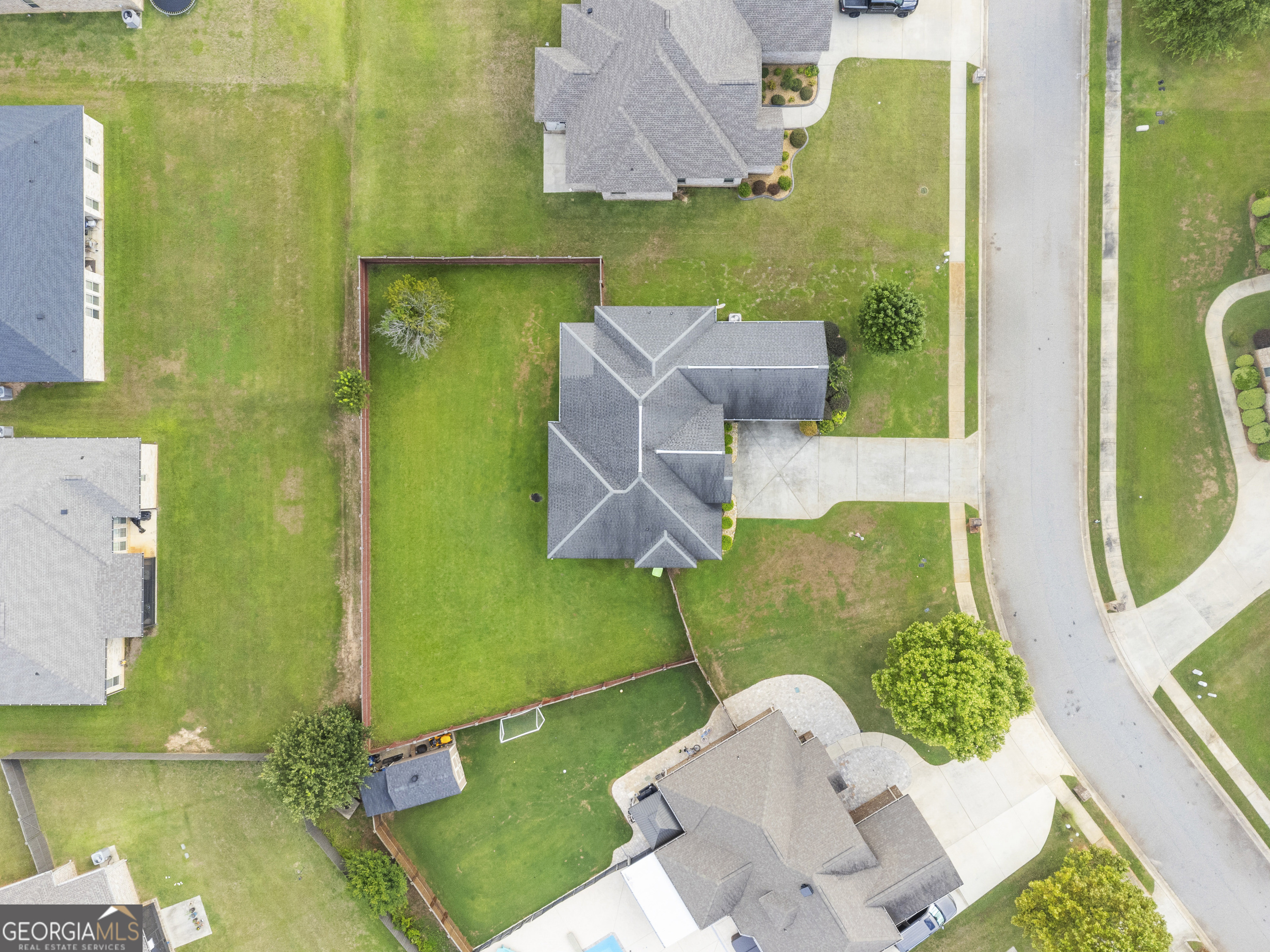 217 Caleb Way Byron, GA 31008 - Photo 55 of 58 an aerial view of a house with a yard