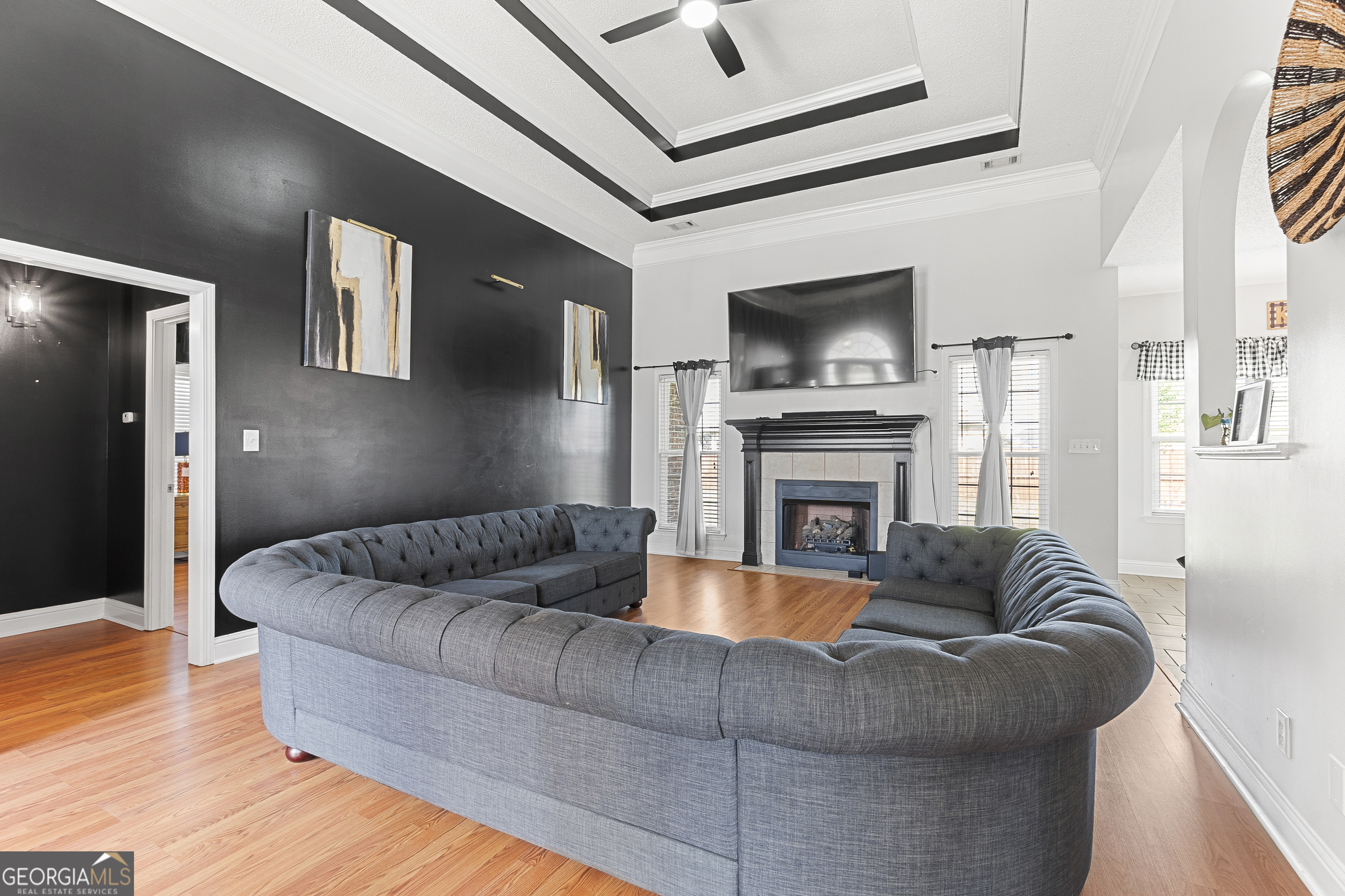 217 Caleb Way Byron, GA 31008 - Photo 10 of 58 a living room with furniture flat screen tv and a fireplace