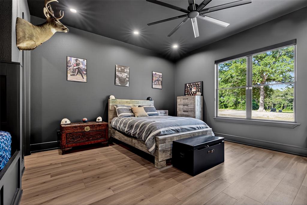 2804 Buchanan Road Hallsville, TX 75650 - Photo 31 of 40 a spacious bedroom with a bed and a window
