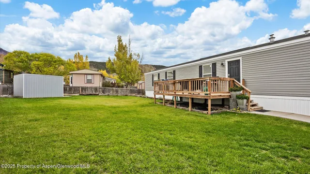 an aerial view of a house with a garden and plants
