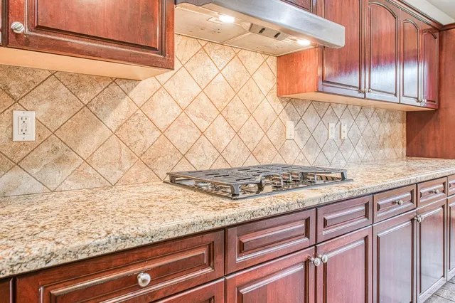 a view of a kitchen with a sink and cabinets