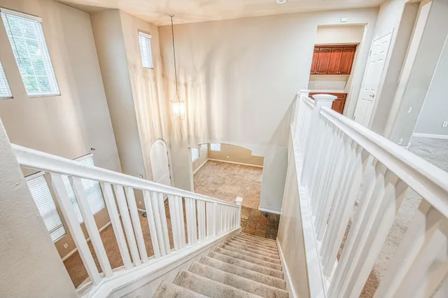 a view of a hallway with windows