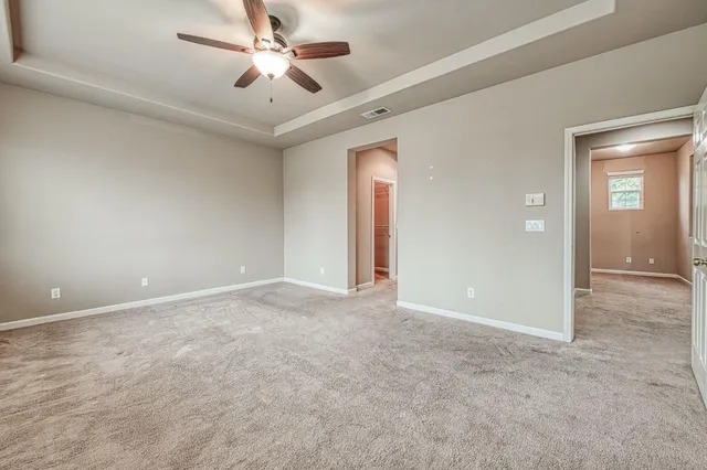 a view of an empty room and window