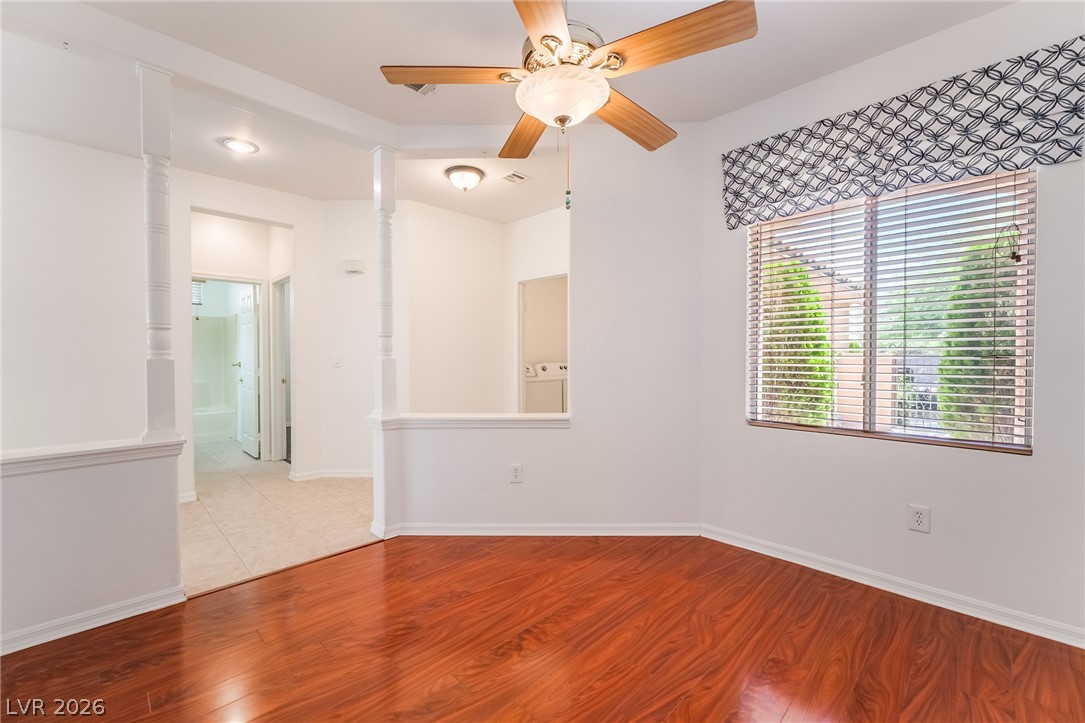 5389 Progresso Street Las Vegas, NV 89135 - Photo 10 of 41 Rich hardwood floors create a welcoming atmosphere in this well-appointed living space.
