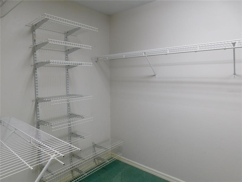 5821 Buck Run Drive Lakeland, FL 33811 - Photo 17 of 30 a room with linen closet and wooden floor