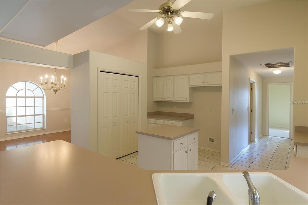 5821 Buck Run Drive Lakeland, FL 33811 - Photo 4 of 30 a view of a kitchen cabinets and a wooden floor