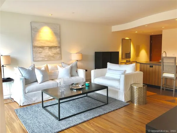 a living room with furniture and a table