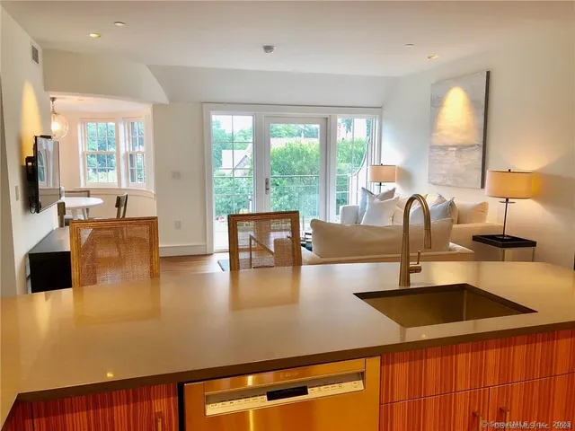 a view of kitchen with dining table and chairs