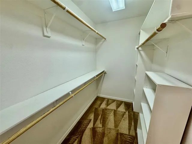 a bathroom with a sink a mirror and a shower