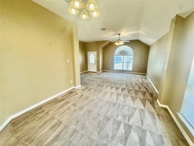 a view of an empty room and a windows