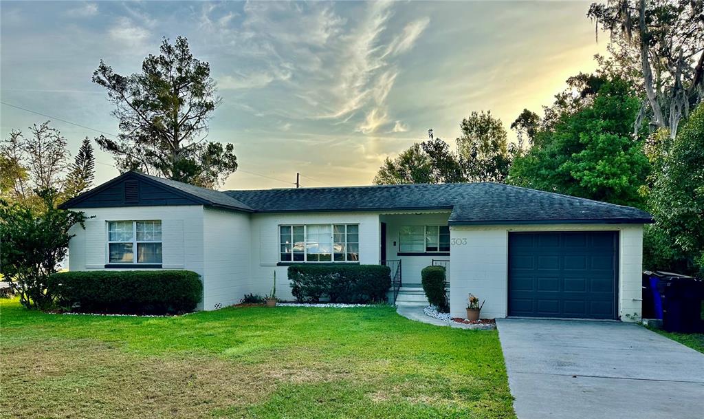 a view of a house with a yard and plants