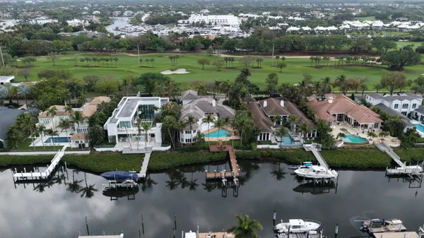 an aerial view of a house with outdoor space