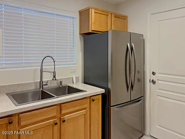 a view of a livingroom with wooden floor and a window