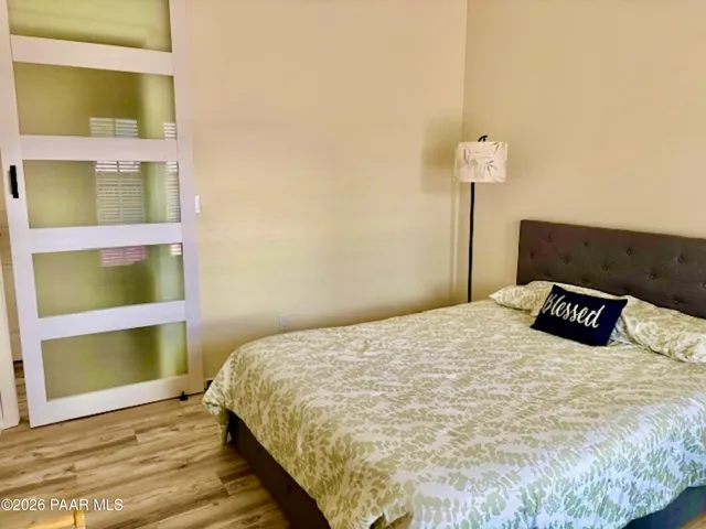 a bedroom with a bed and a table