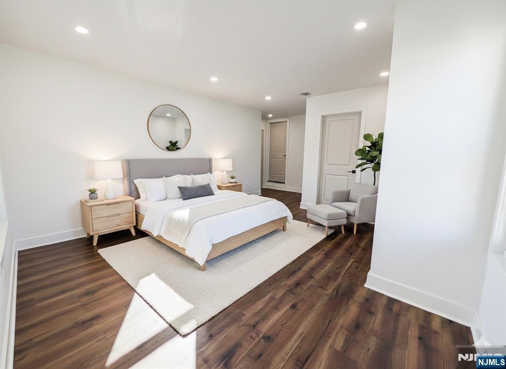 93 May Street Hawthorne, NJ 07506 - Photo 12 of 21 a bedroom with a bed and a potted plant