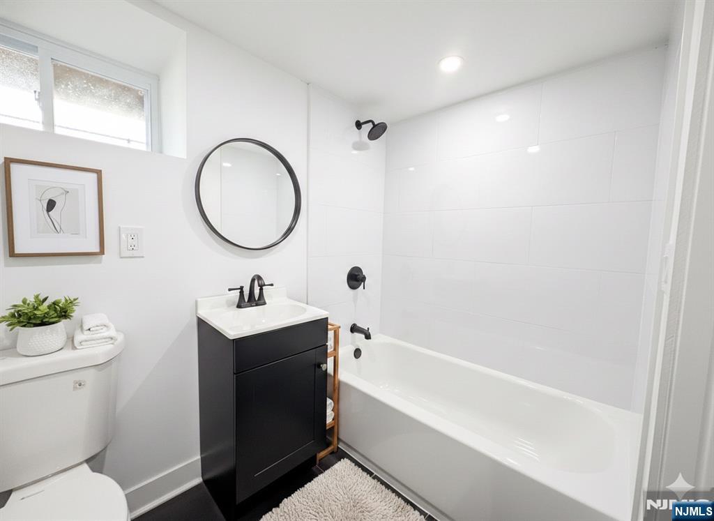 93 May Street Hawthorne, NJ 07506 - Photo 16 of 21 a bathroom with a sink toilet and a bathtub