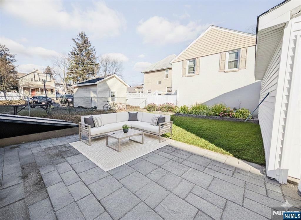 93 May Street Hawthorne, NJ 07506 - Photo 19 of 21 a view of a patio with couches and a fire pit