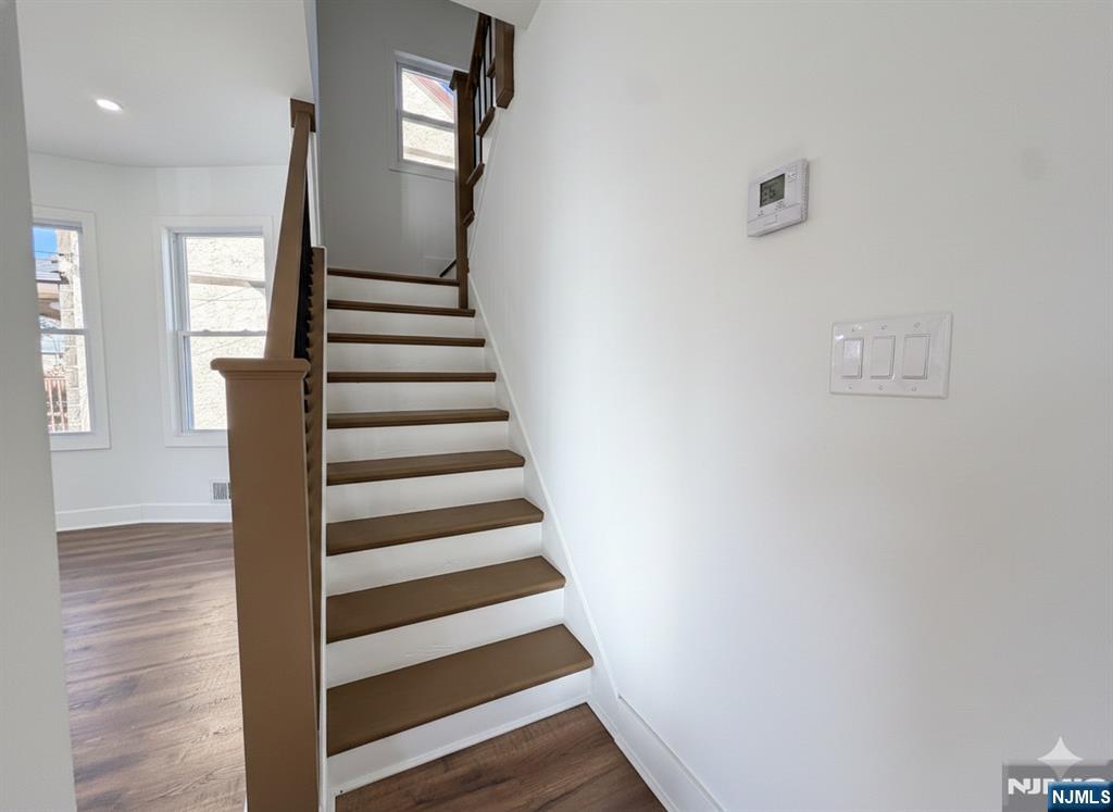 93 May Street Hawthorne, NJ 07506 - Photo 20 of 21 a view of entryway with wooden floor and stairs