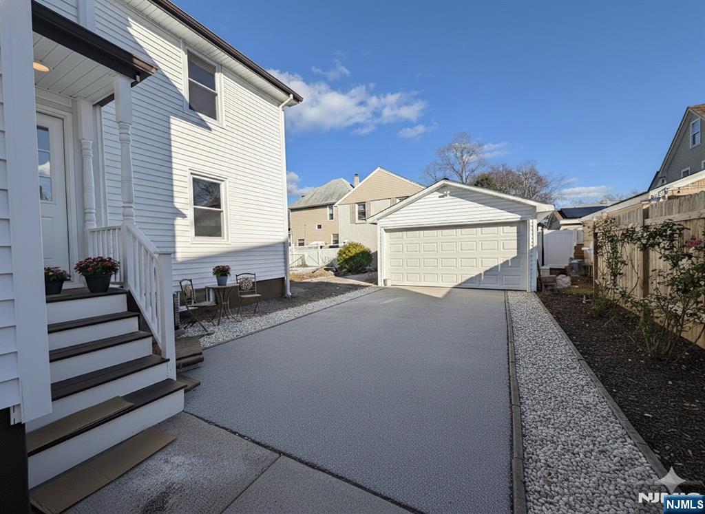 93 May Street Hawthorne, NJ 07506 - Photo 21 of 21 a view of a patio with couches chairs and potted plants
