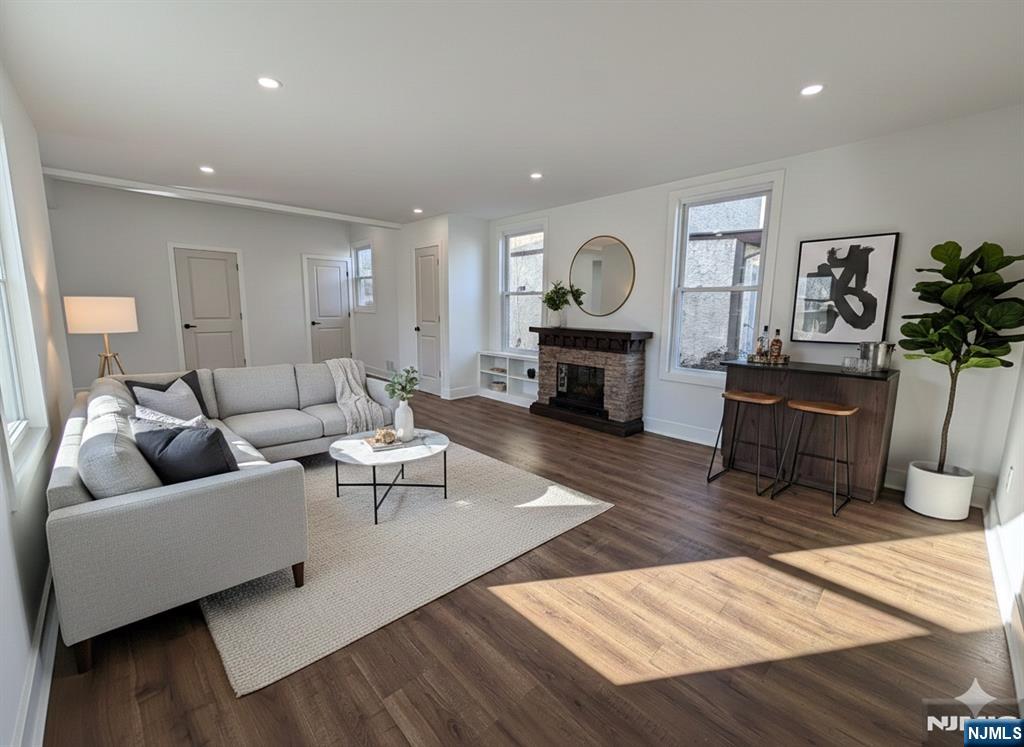 93 May Street Hawthorne, NJ 07506 - Photo 8 of 21 a living room with furniture and a fireplace