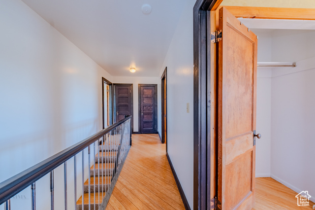 6178 East Zion Road Kanab, UT 84741 - Photo 21 of 48 Corridor featuring light wood finished floors and an upstairs landing