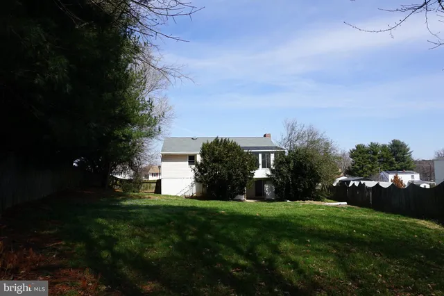 a view of a field with grass and a yard