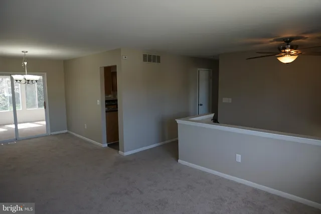 a kitchen with granite countertop cabinets sink and window