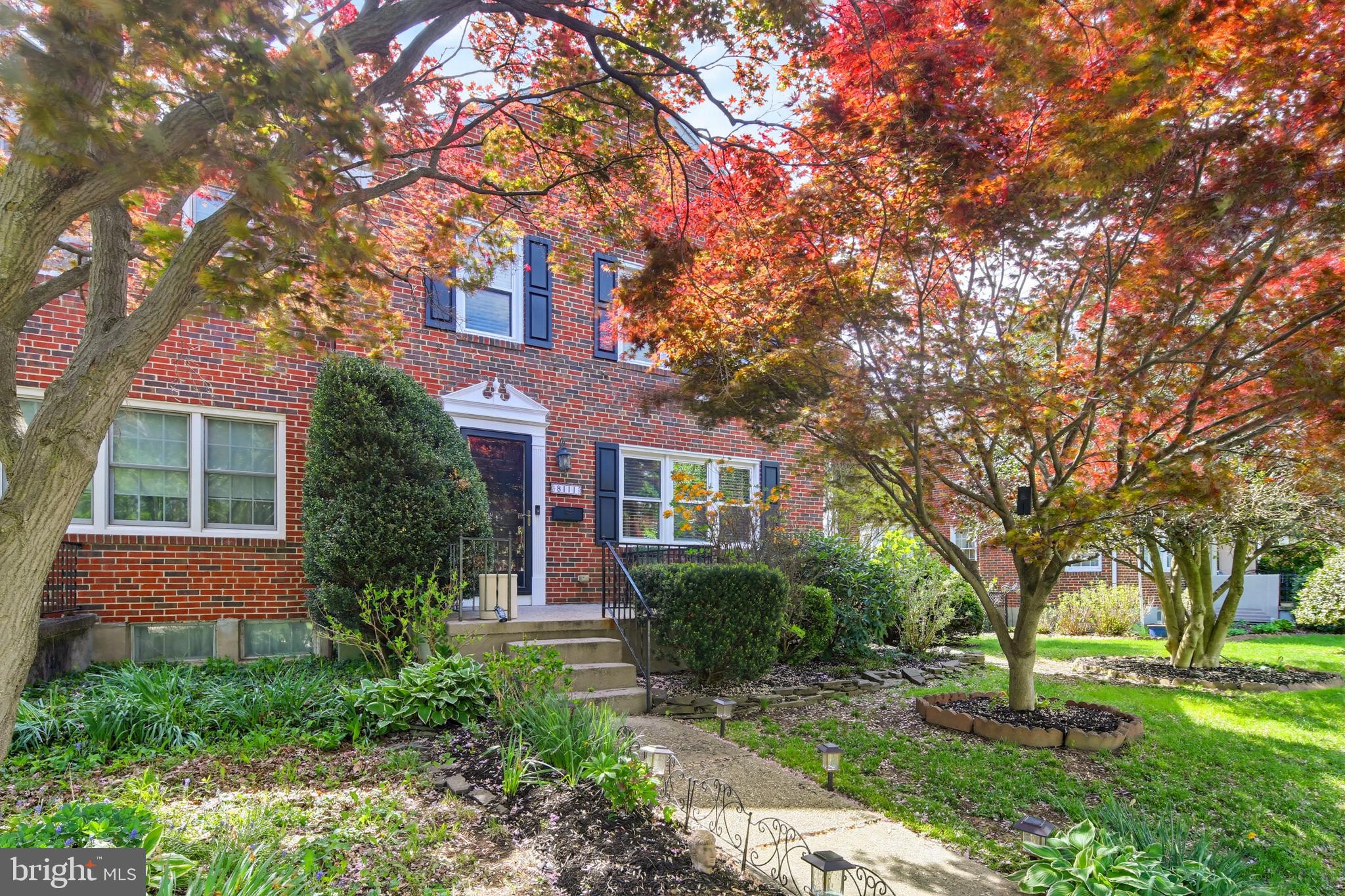 8111 Barksdale Road Baltimore, MD 21286 - Photo 1 of 39 a front view of a house with a garden