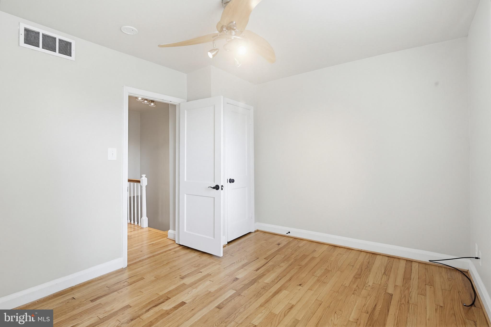 8111 Barksdale Road Baltimore, MD 21286 - Photo 16 of 39 wooden floor in an empty room