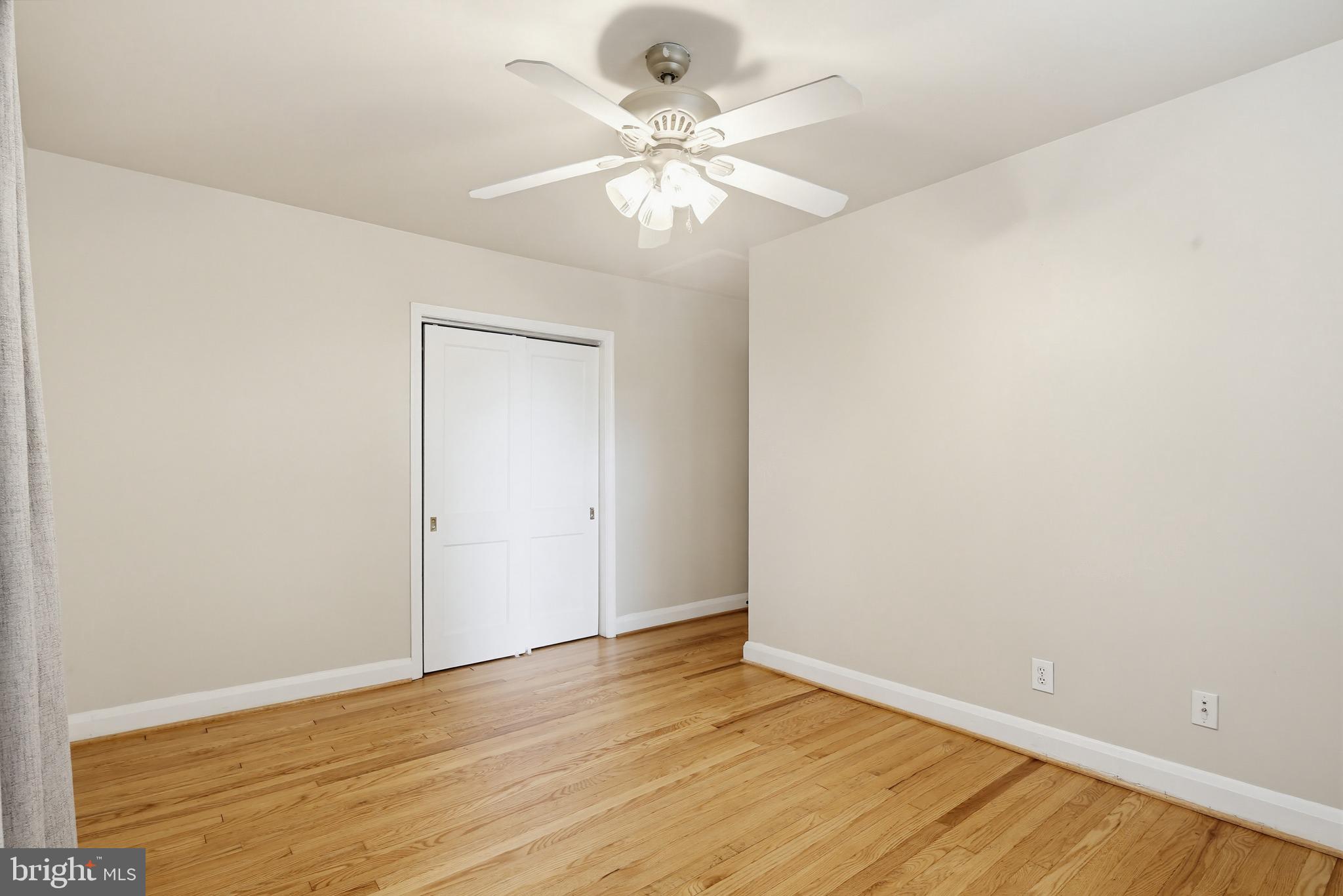 8111 Barksdale Road Baltimore, MD 21286 - Photo 19 of 39 a view of an empty room with wooden floor