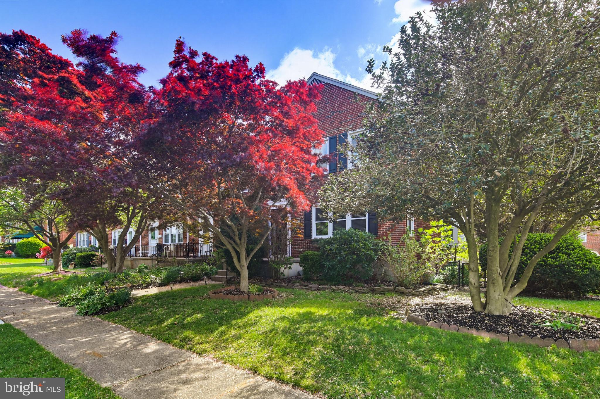 8111 Barksdale Road Baltimore, MD 21286 - Photo 3 of 39 a front view of a house with garden