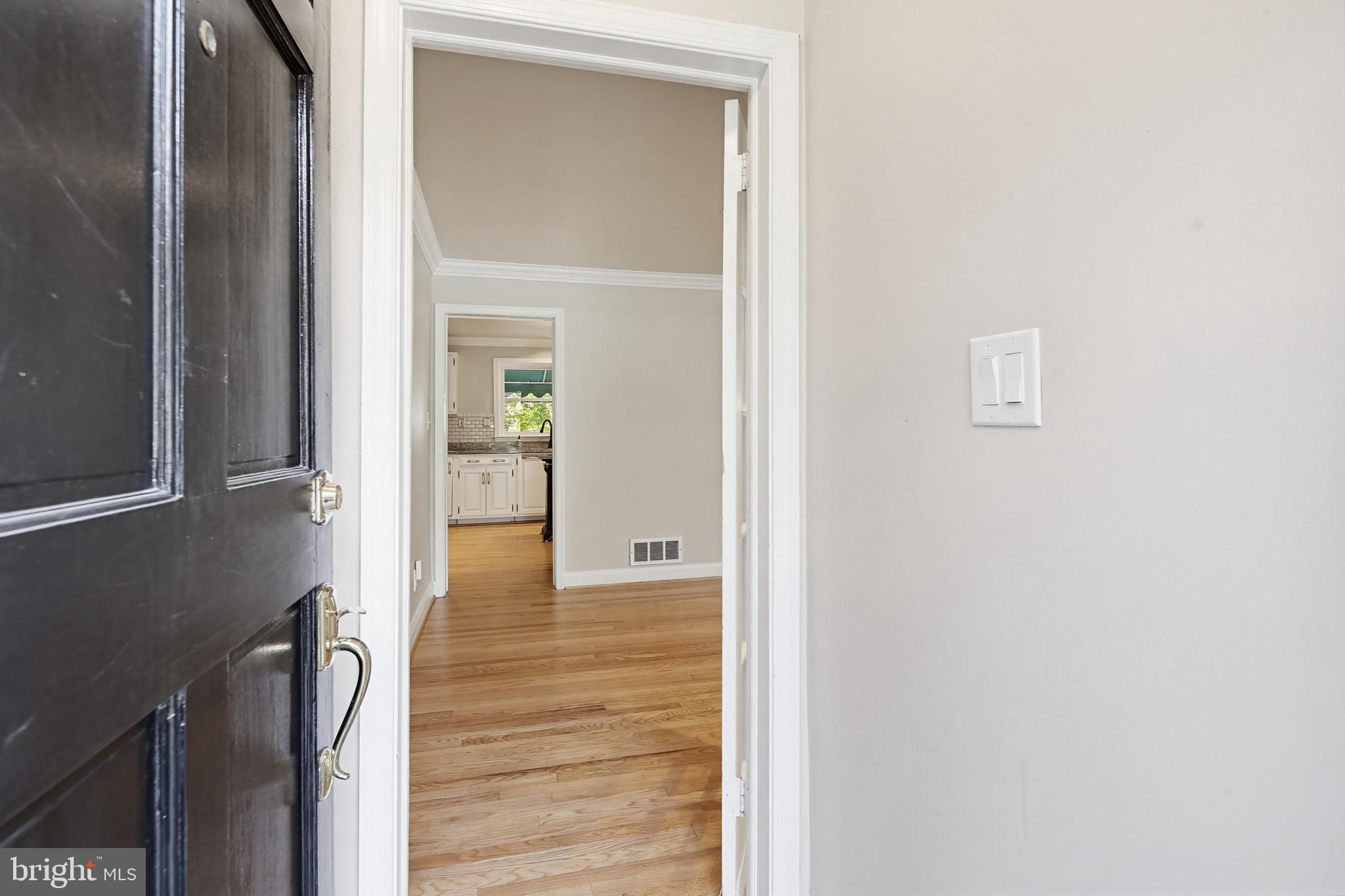 8111 Barksdale Road Baltimore, MD 21286 - Photo 4 of 39 a view of a hallway with wooden floor