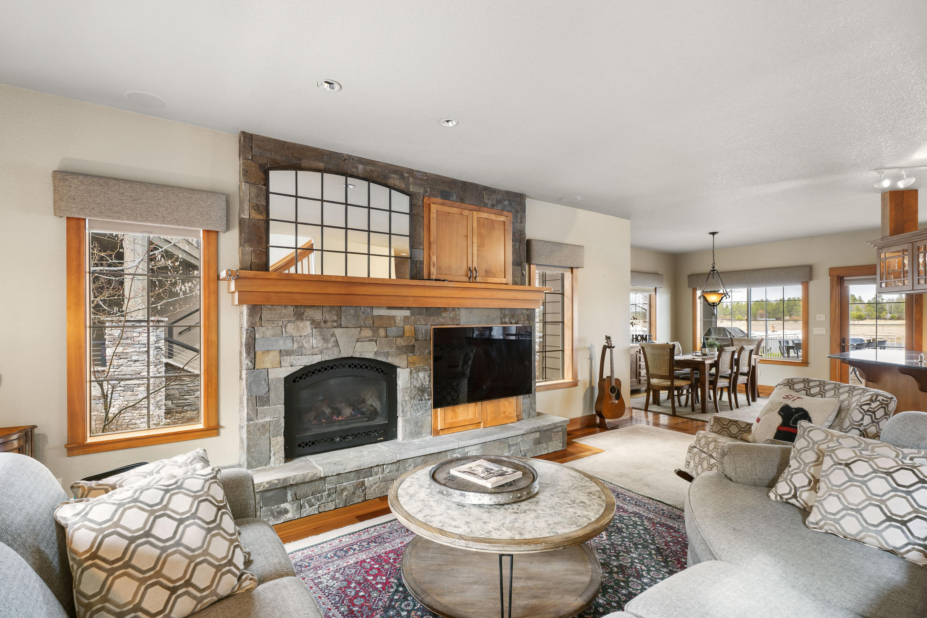 56902 River Road, Unit 6 Sunriver, OR 97707 - Photo 5 of 44 Great room w/ gas fireplace & stacked stone surround.