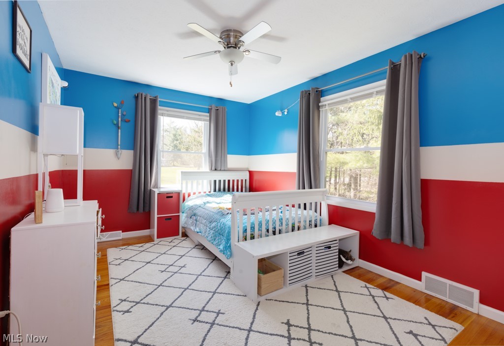 195 South Medina Line Road Akron, OH 44321 - Photo 22 of 41 Bedroom with multiple windows and wood flooring