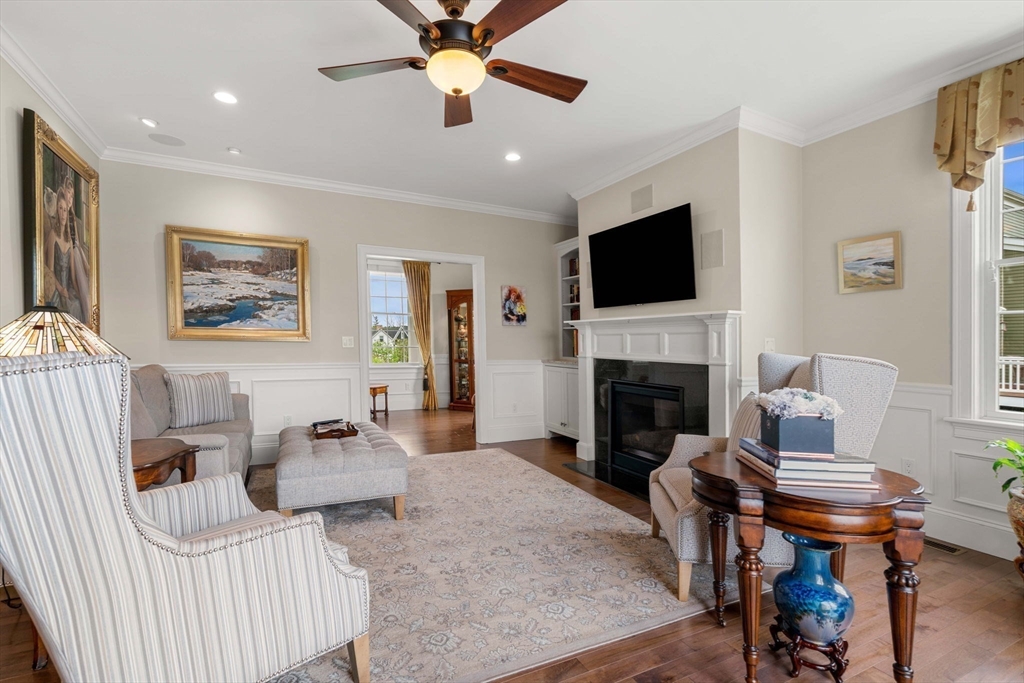 4 Point Shore Overlook Amesbury, MA 01913 - Photo 13 of 42 a living room with furniture a flat screen tv and a fireplace