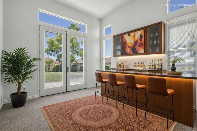 a kitchen with kitchen island granite countertop a sink stove and refrigerator