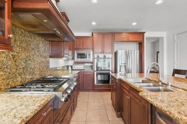 a bedroom with a bed and a tv