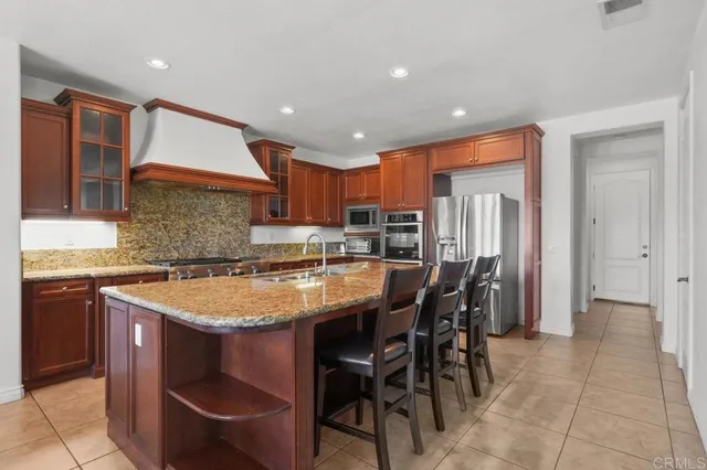 a bedroom with a bed dresser and a window