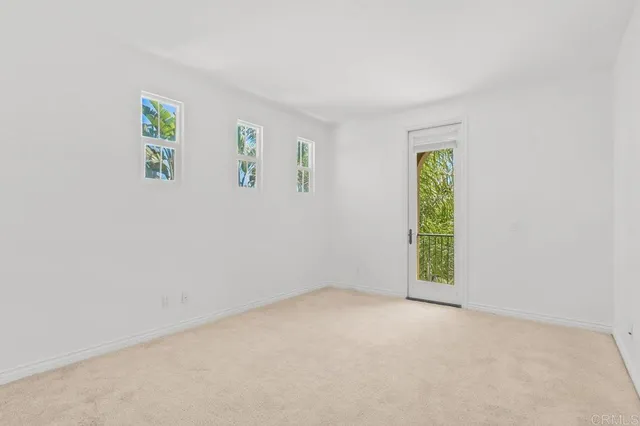 a front view of a house with garden and patio