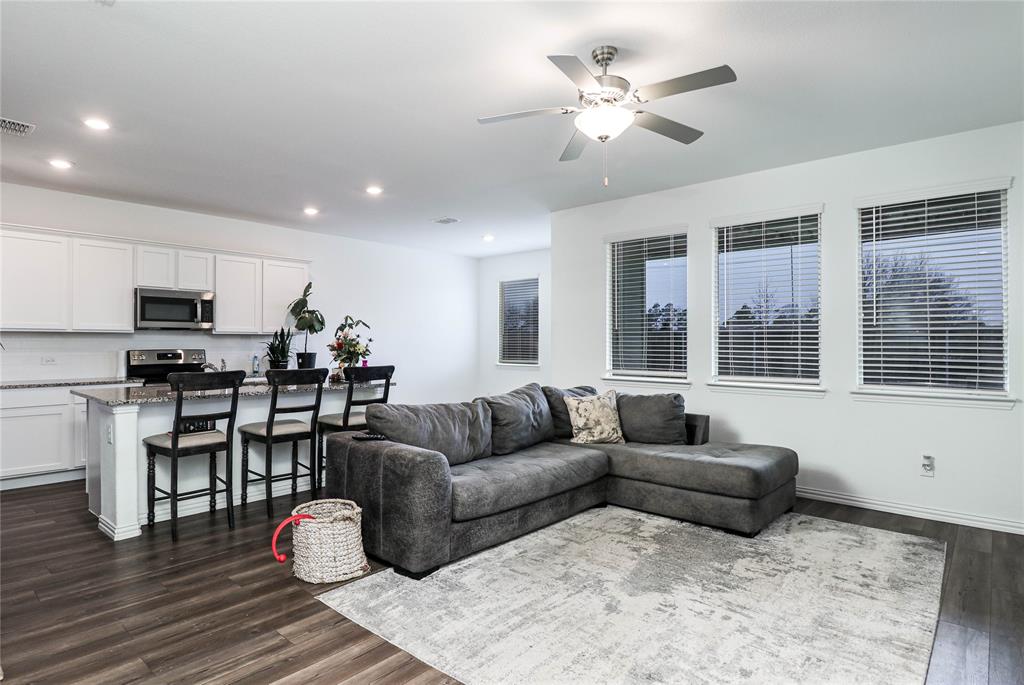 5106 Parrington Drive Princeton, TX 75407 - Photo 1 of 1 a living room with furniture kitchen view and a wooden floor