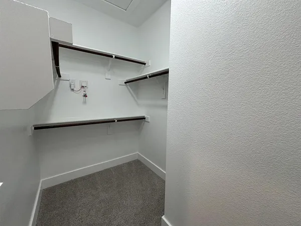 a view of an empty walk in closet