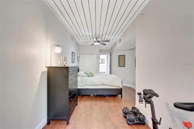 a bedroom with furniture and a wooden floor