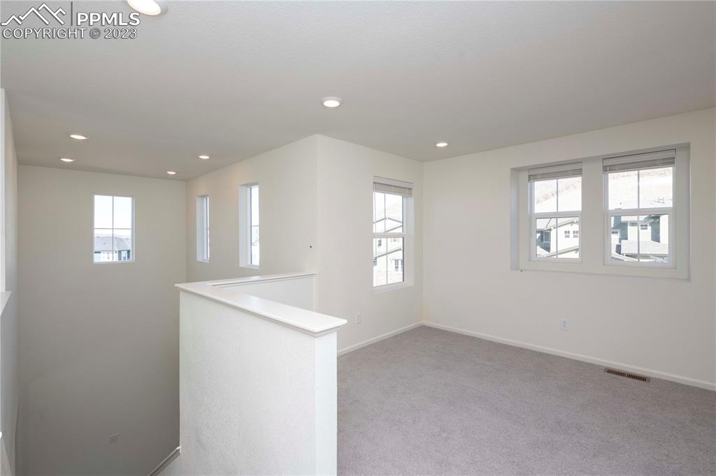 210 Felicity Loop Castle Rock, CO 80109 - Photo 15 of 27 a view of an empty room with a window