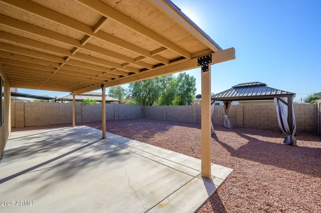 a view of a backyard of a house