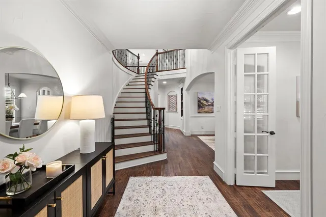 a view of entryway and hall with wooden floor