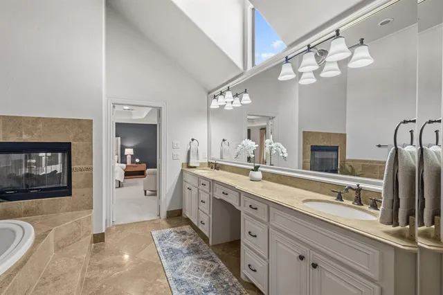 a bathroom with a tub and a shower