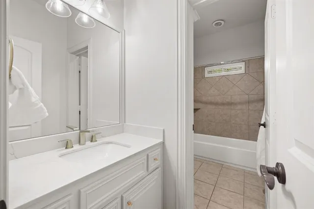 a bathroom with a sink and mirror